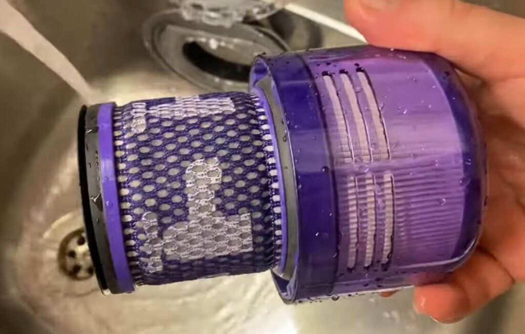How can one clean the Dyson V11 Vacuum Filter